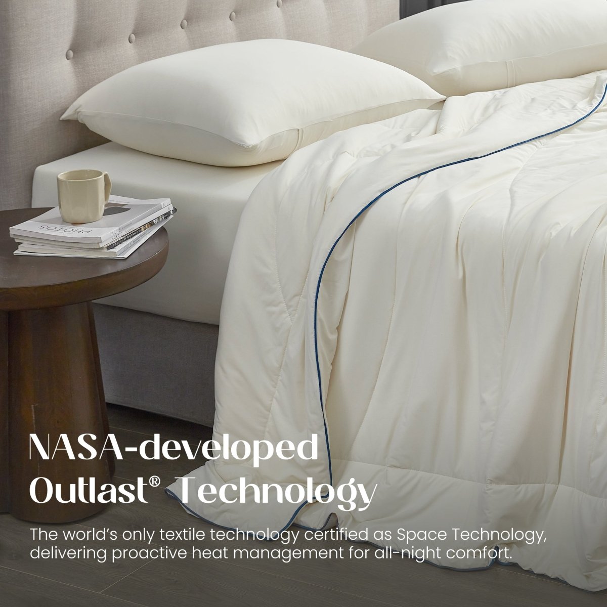 Bed with ivory bedding and pillows, featuring NASA-developed Outlast Technology text.#color_Ivory
