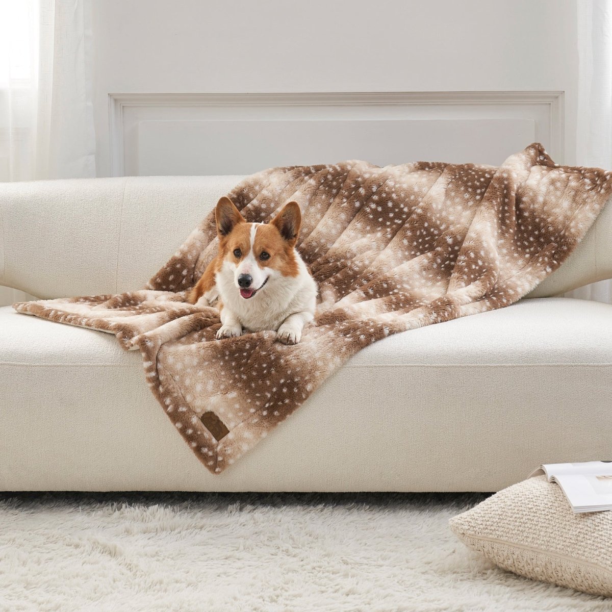 Cozy Bliss Leakproof Faux Fur Pet Blanket in deer print front view with a dog sitting on it. #color_Brown Sherpa Deer