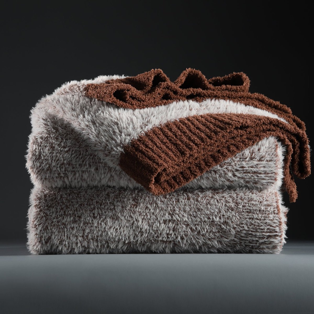 Faux Mink Feather Knit Throw Blanket in Brown neatly folded stack, showcasing soft feather yarn and premium texture. #color_Brown