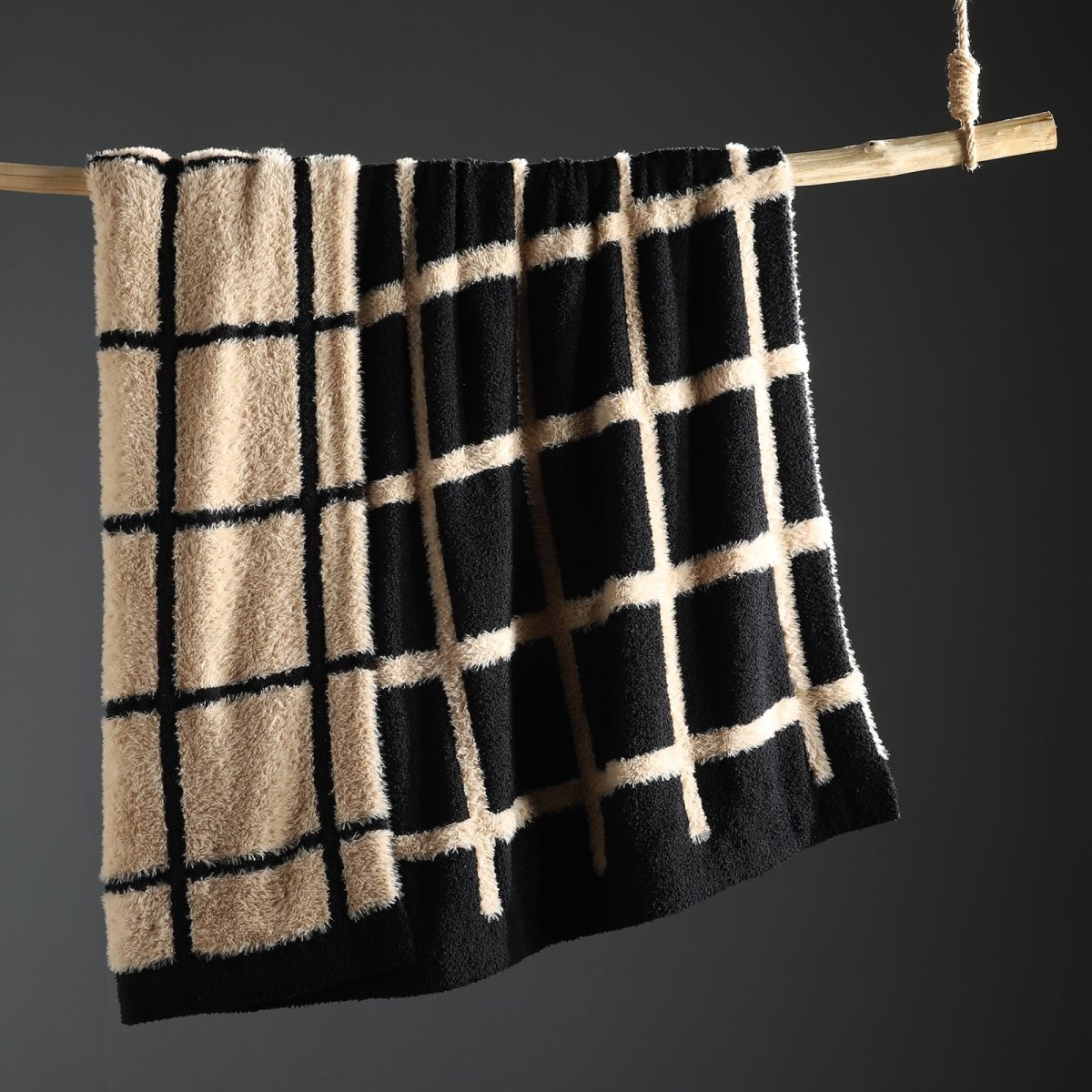 Faux Mink Textured Plaid Knit Throw Blanket in Black front view hanging display, showcasing plush faux mink texture and plaid pattern design. #color_Black