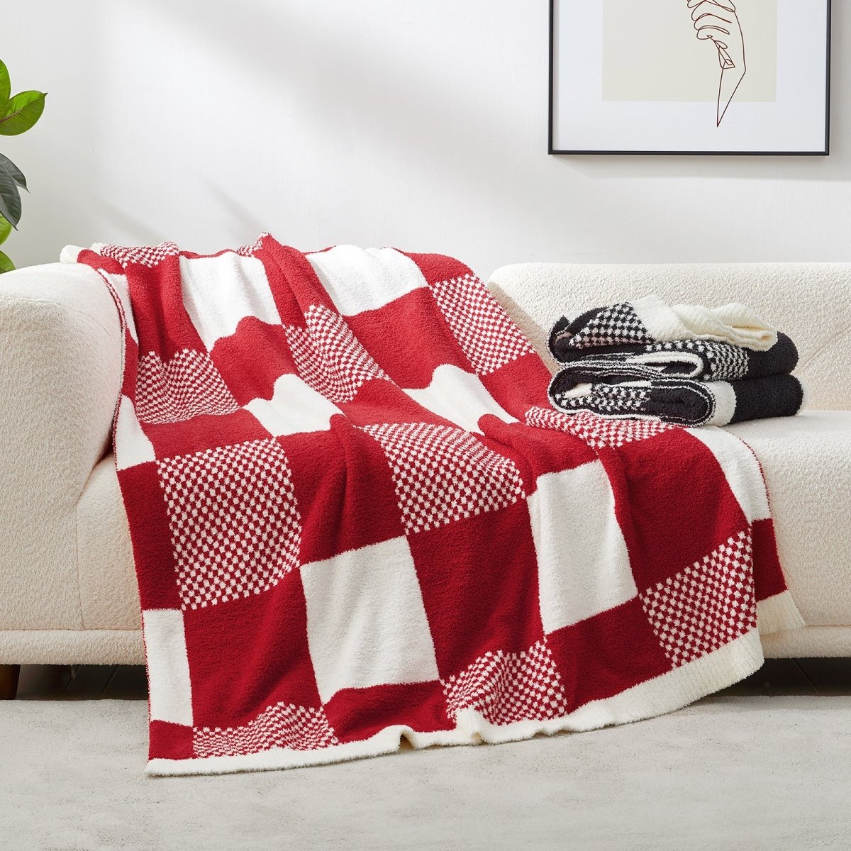 Checkered Feather Yarn Throw Blanket in Red & Cream draped over a sofa, adding warmth and a cozy layered look. #color_Red & Cream