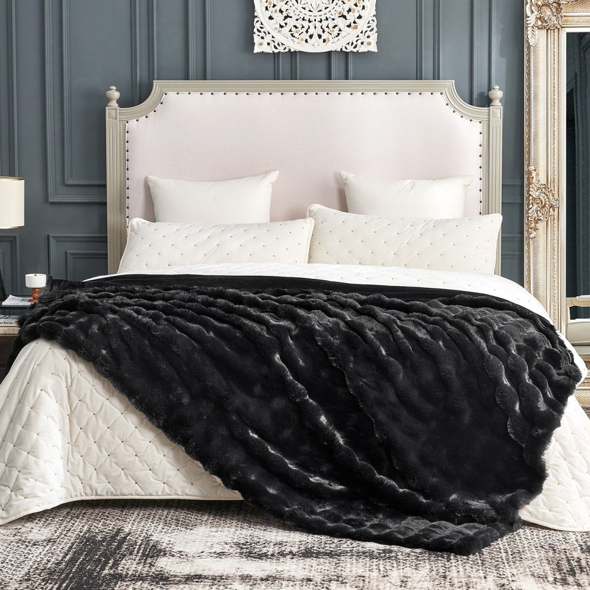 Cozy Bliss black faux fur throw blanket on bed. Cozy and soft blanket for bedroom. #color_Black