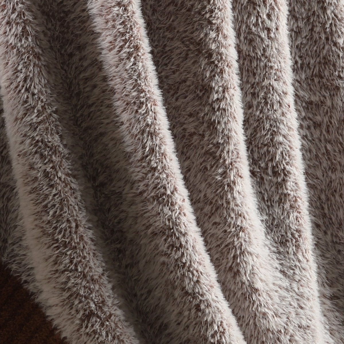 Close-up of faux mink texture on Faux Mink Feather Knit Throw Blanket in Brown highlighting soft plush fibers and cozy feel. #color_Brown