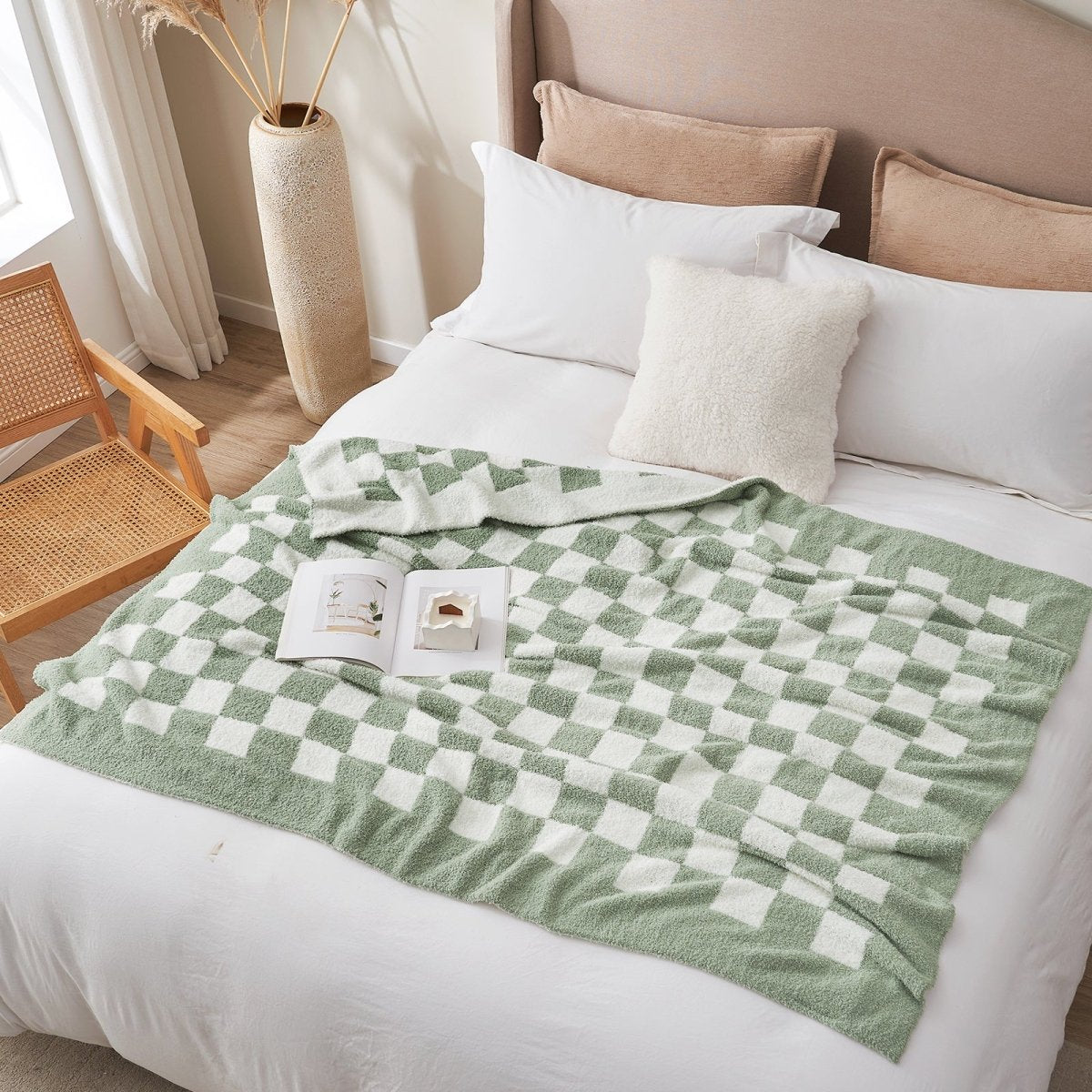 Checkered Feather Yarn Knit Throw Blanket in Sage Green & White styled on a bed in a bright bedroom. #color_Sage Green & White