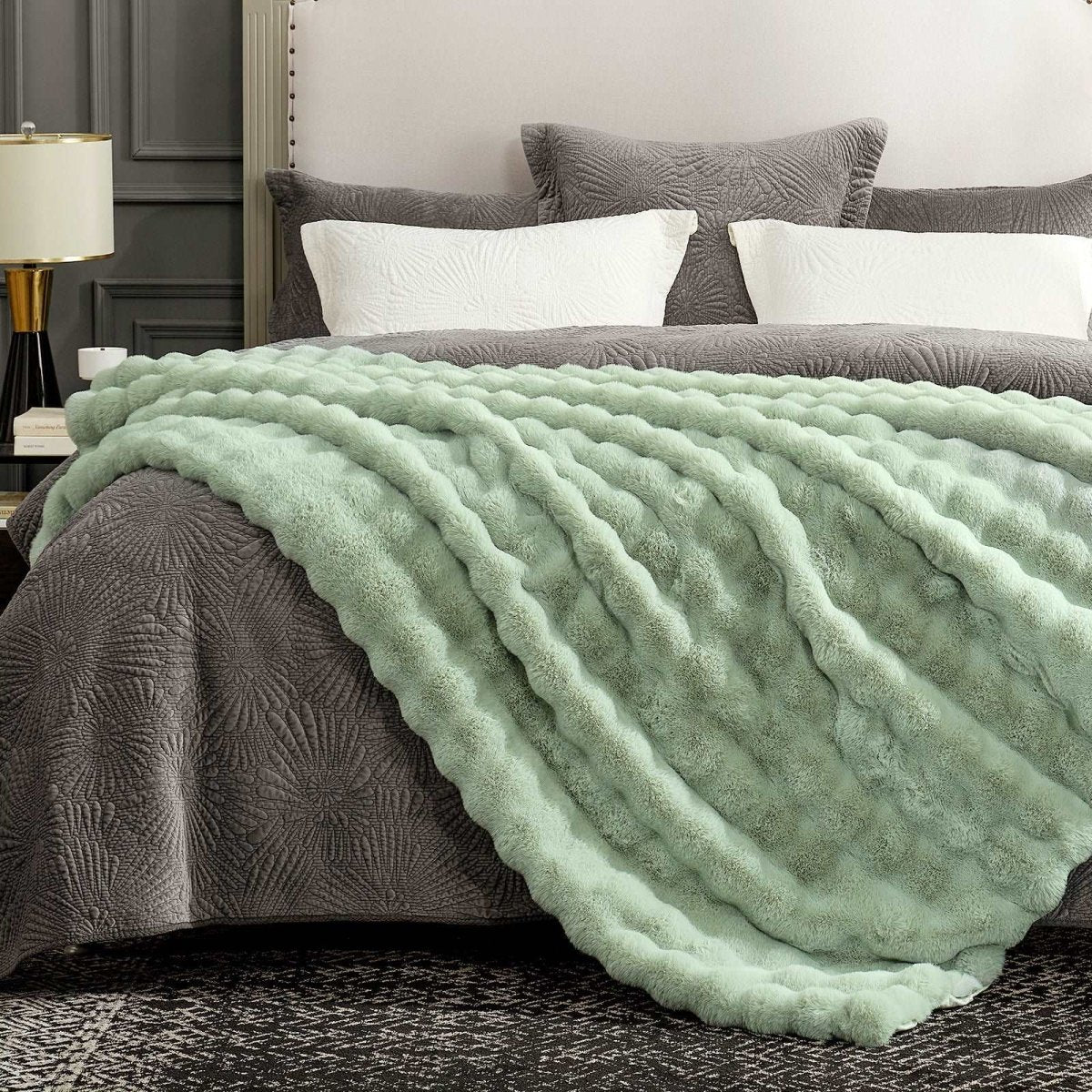 Cozy Bliss throw blanket on bed. Cozy and soft blanket for bedroom comfort. #color_Sage Green
