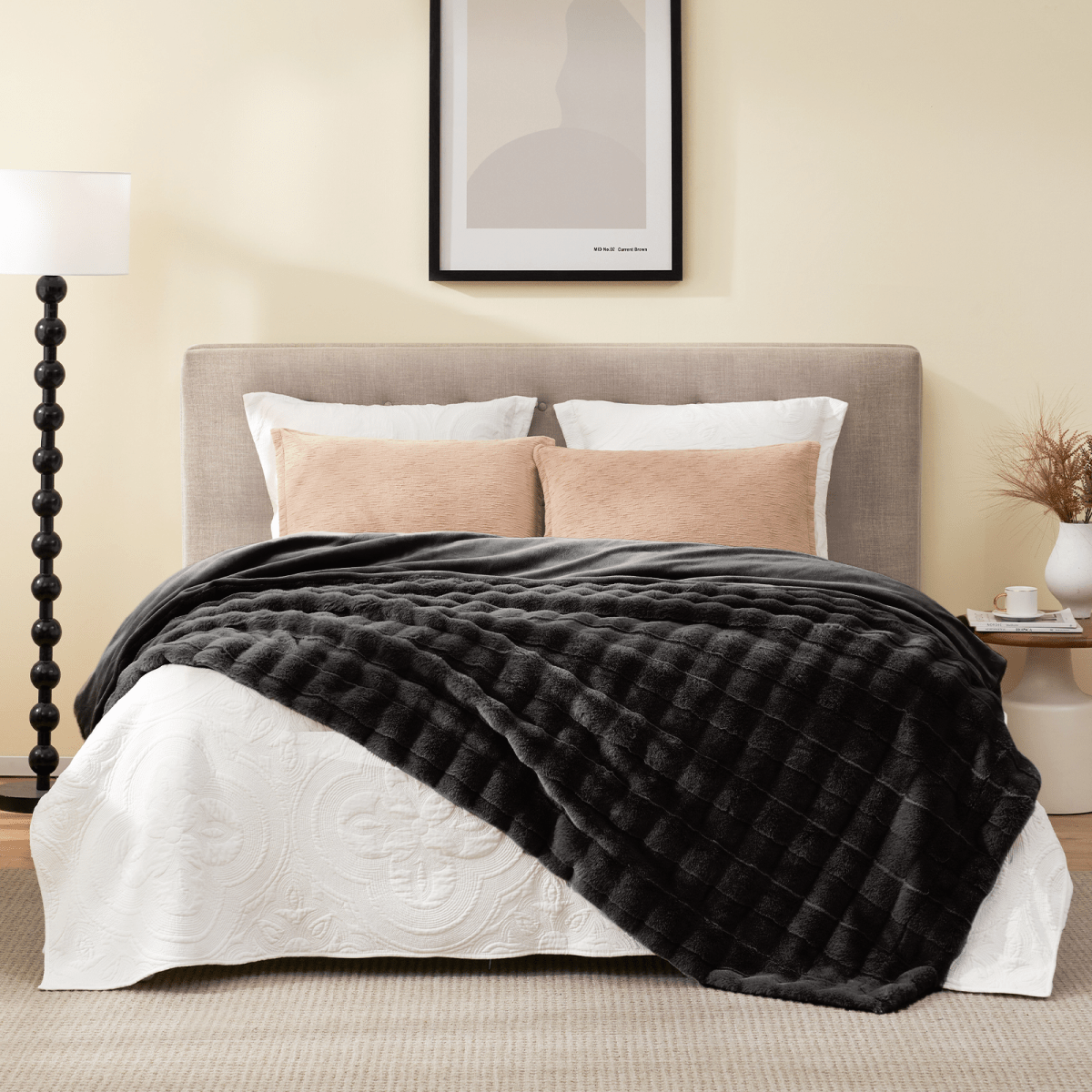 Charcoal black cross-striped faux fur throw blanket on bed. Cozy and soft blanket for bedroom comfort #color_Black