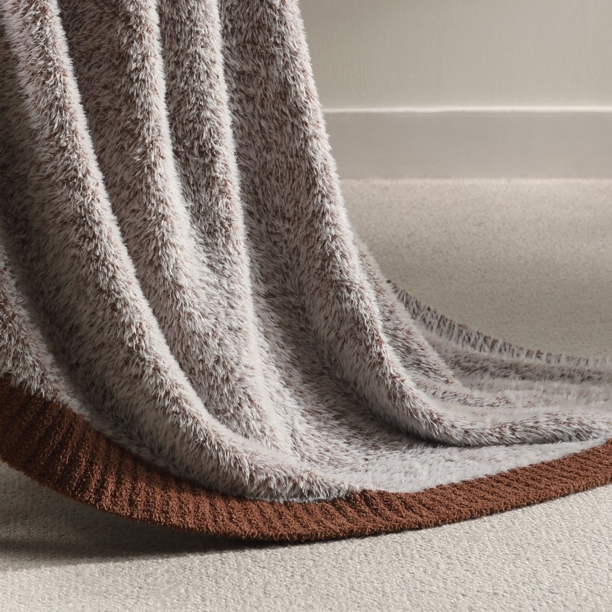 Close-up of plush feather yarn on Faux Mink Feather Knit Throw Blanket in Brown highlighting dense and soft fabric texture. #color_Brown
