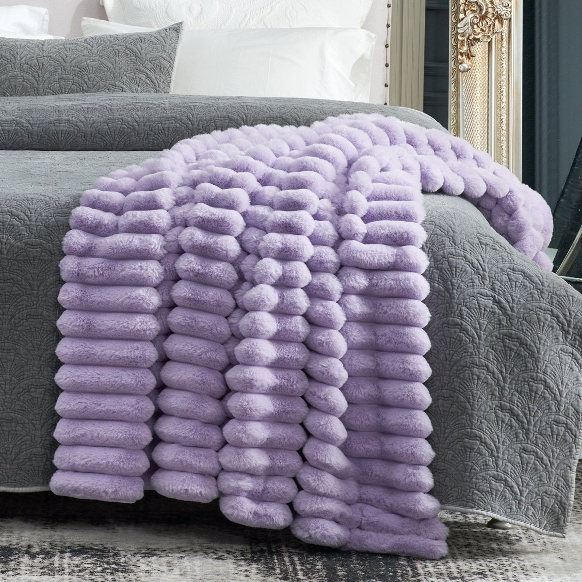 Cozy Bliss Purple faux fur throw blanket on bed, perfect for adding warmth to home. #color_Purple