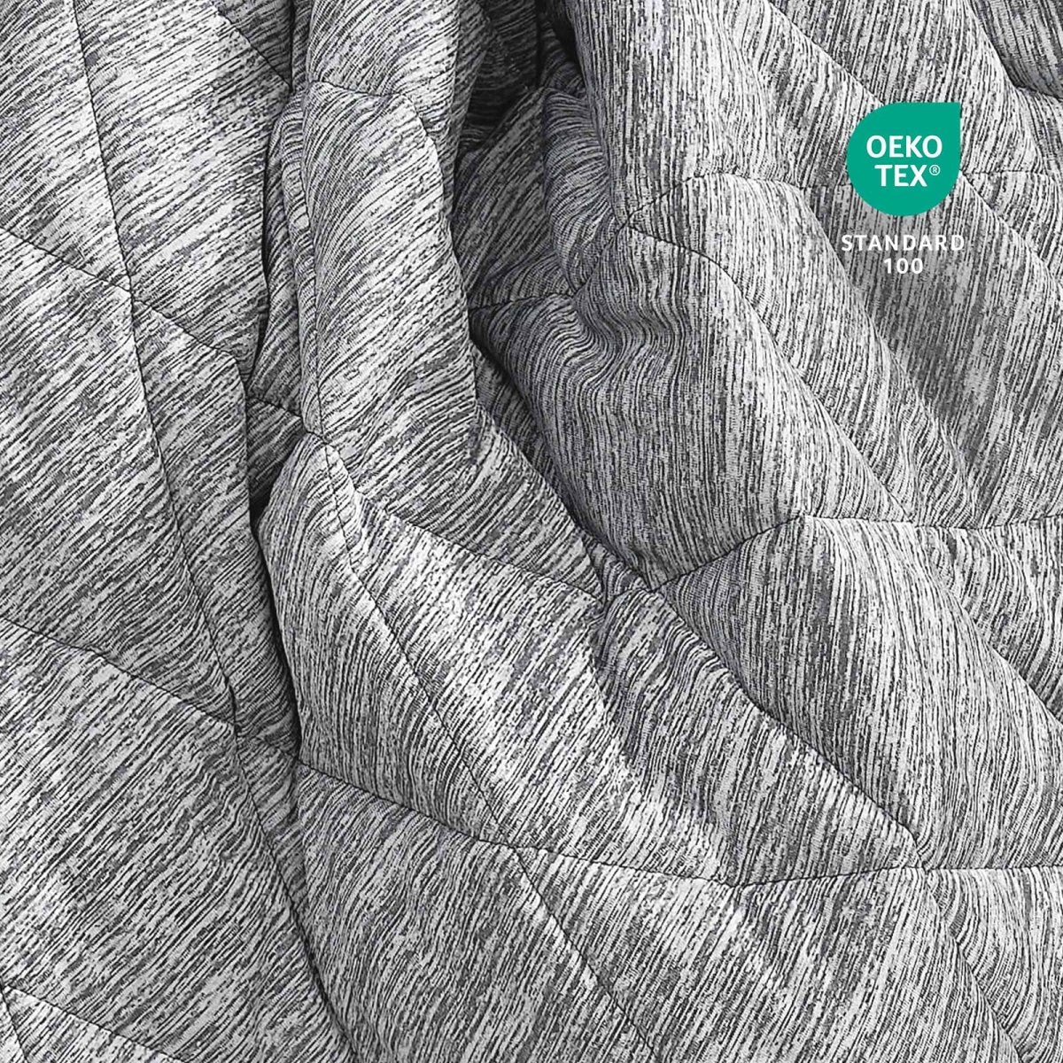 Close-up of Cozy Bliss fabric with OEKO-TEX standard 100 certification.#color_Grey