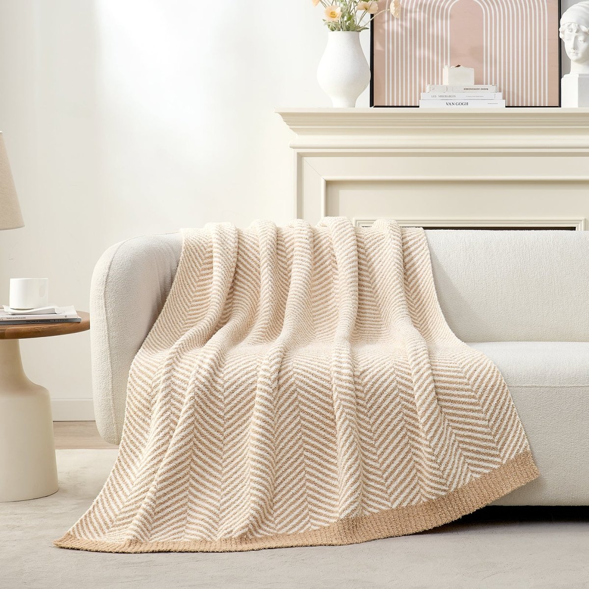 Cozy Bliss reversible knit throw blanket draped elegantly over a cream sofa #color_Beige