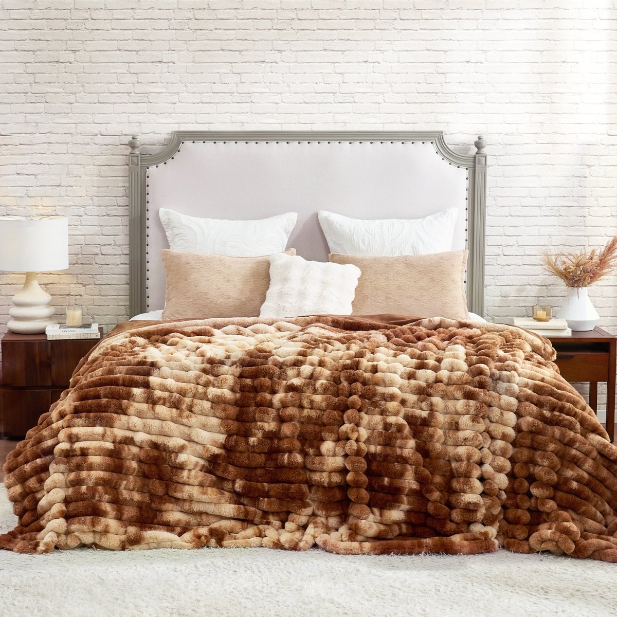 Bed with brown and beige textured blanket, white pillows, and a gray upholstered headboard. #Color_Tie-dye Brown