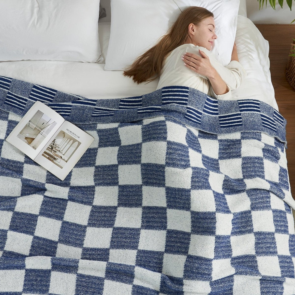 Woman sleeping under a Reversible Heather Checkered Feather Yarn Throw Blanket in Navy, offering cozy warmth and everyday comfort. #color_Navy Blue