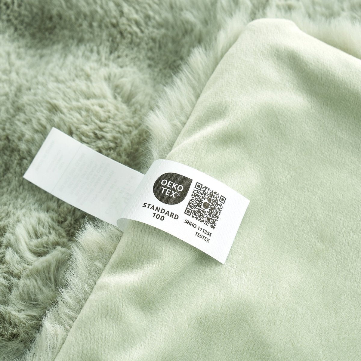 Close-up of OEKO-TEX certified faux fur sage green blanket fabric. #color_Sage Green