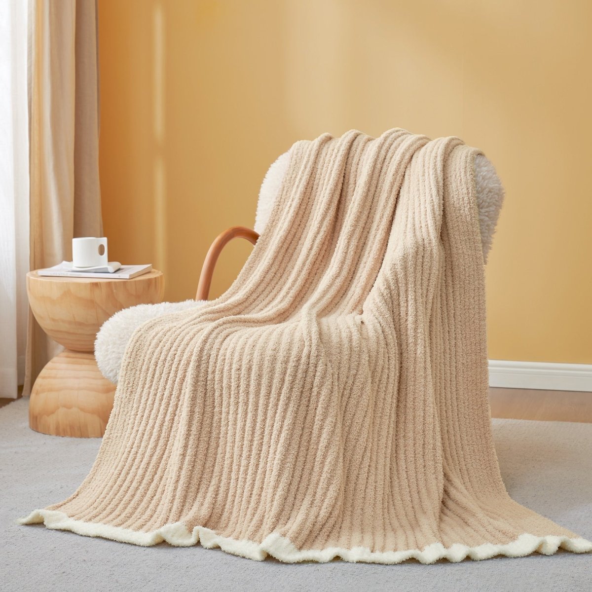 Soft Ribbed Feather Yarn Throw Blanket in Beige draped over an armchair, showcasing ribbed texture and soft feather yarn design. #Color_Beige