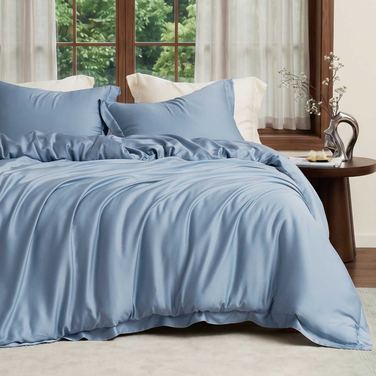 Cozy Bliss Tencel™ Eco-friendly Silky Duvet Cover Set displayed on a bed in a bedroom, showcasing the complete bedding set. #color_Dark Blue