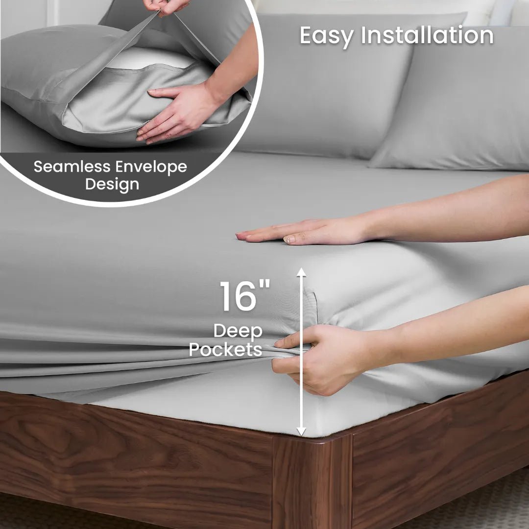 Close-up of hands fitting Cozy Bliss Tencel™ Eco-friendly Silky Sheet Set onto a mattress, showing 16-inch deep pocket design. #color_Grey