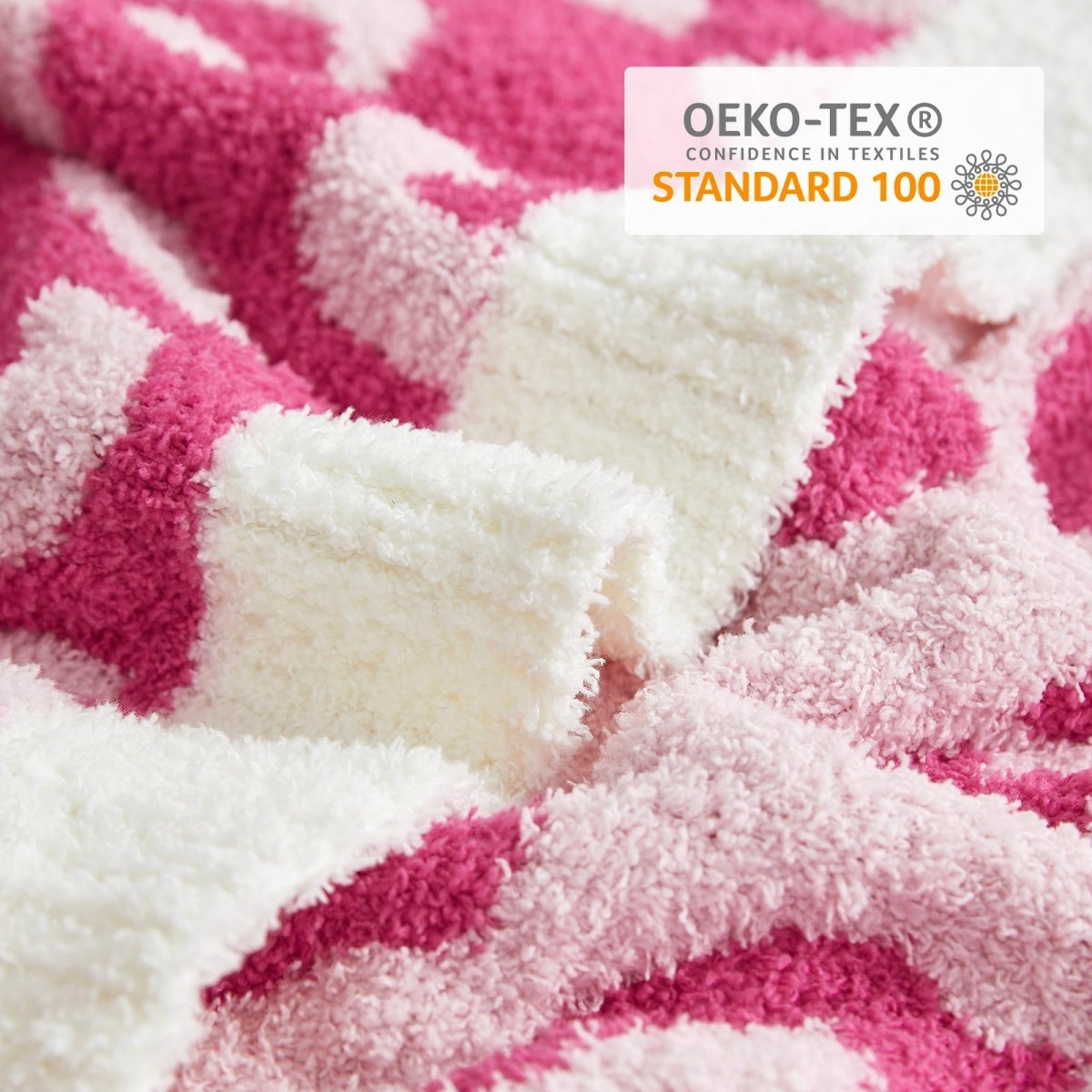 Close-up of Reversible Leopard Feather Yarn Throw Blanket in Hot Pink showcasing soft texture and OEKO-TEX STANDARD 100 certification. #color_Hot Pink