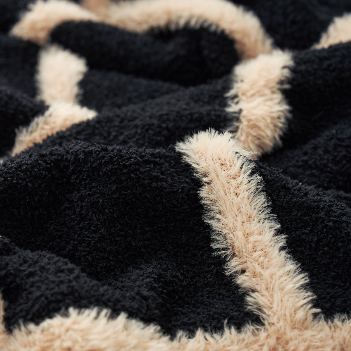 Close-up of black and beige textured fabric pattern#color_Black