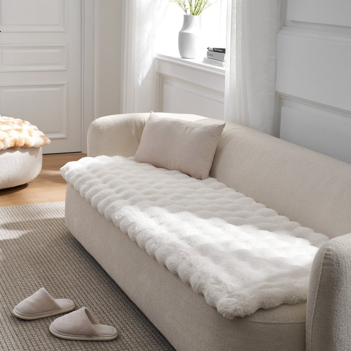 Cream White couch cover on a beige sofa with a plant in the background#color_Cream White