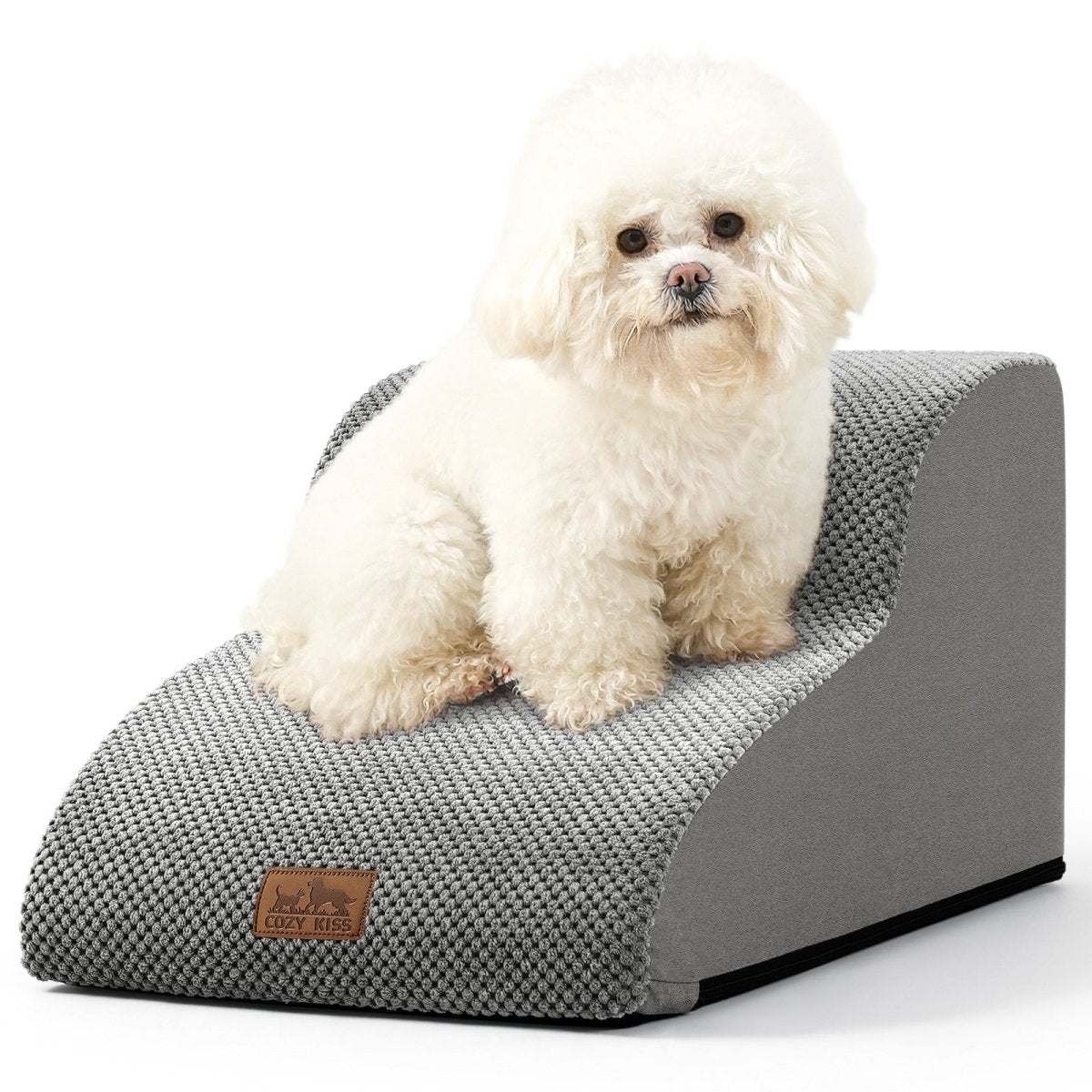 Small white dog sitting on a gray pet bed#Color_Grey
