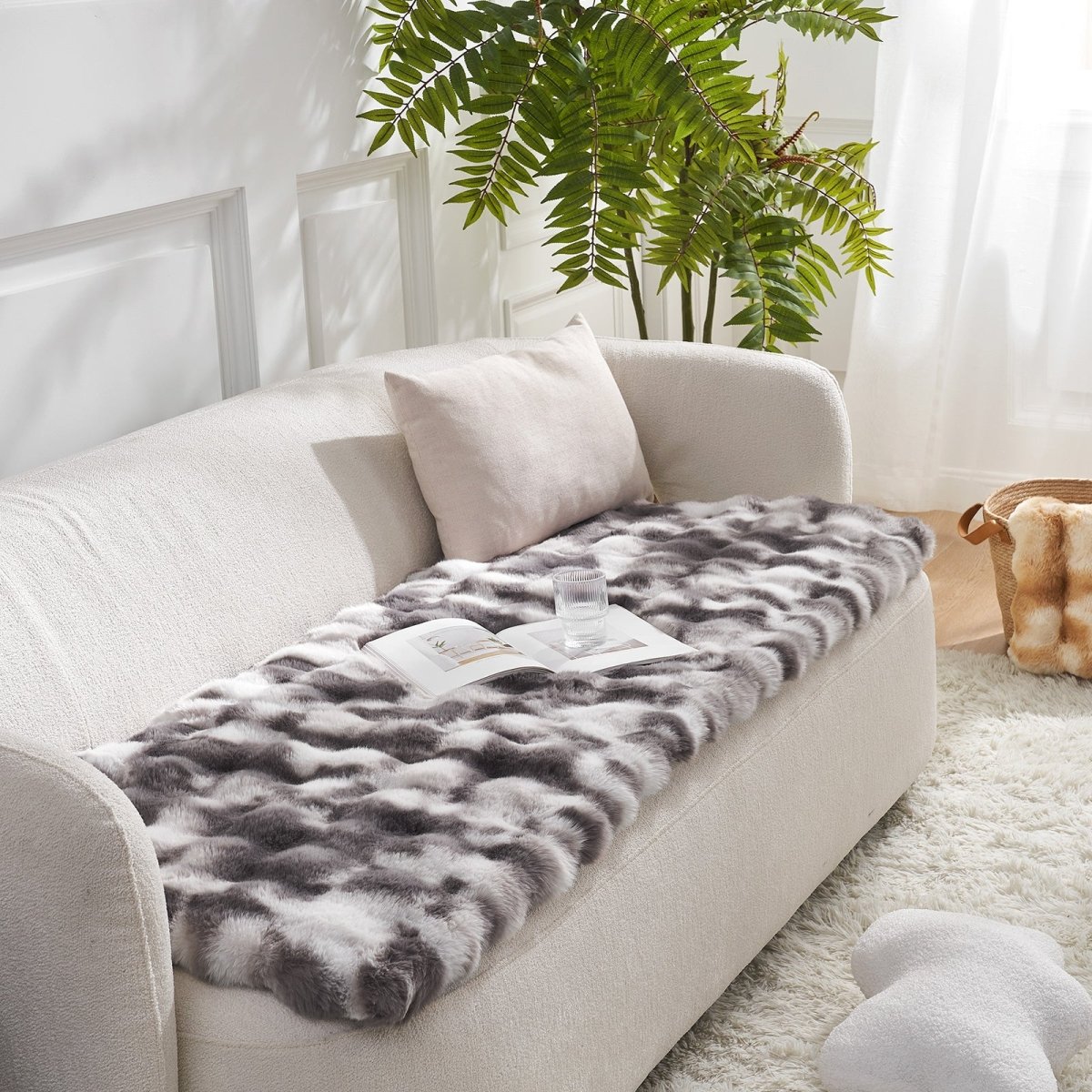 Tie-dye grey couch cover on a beige sofa with a plant in the background#color_Tie-dye Grey