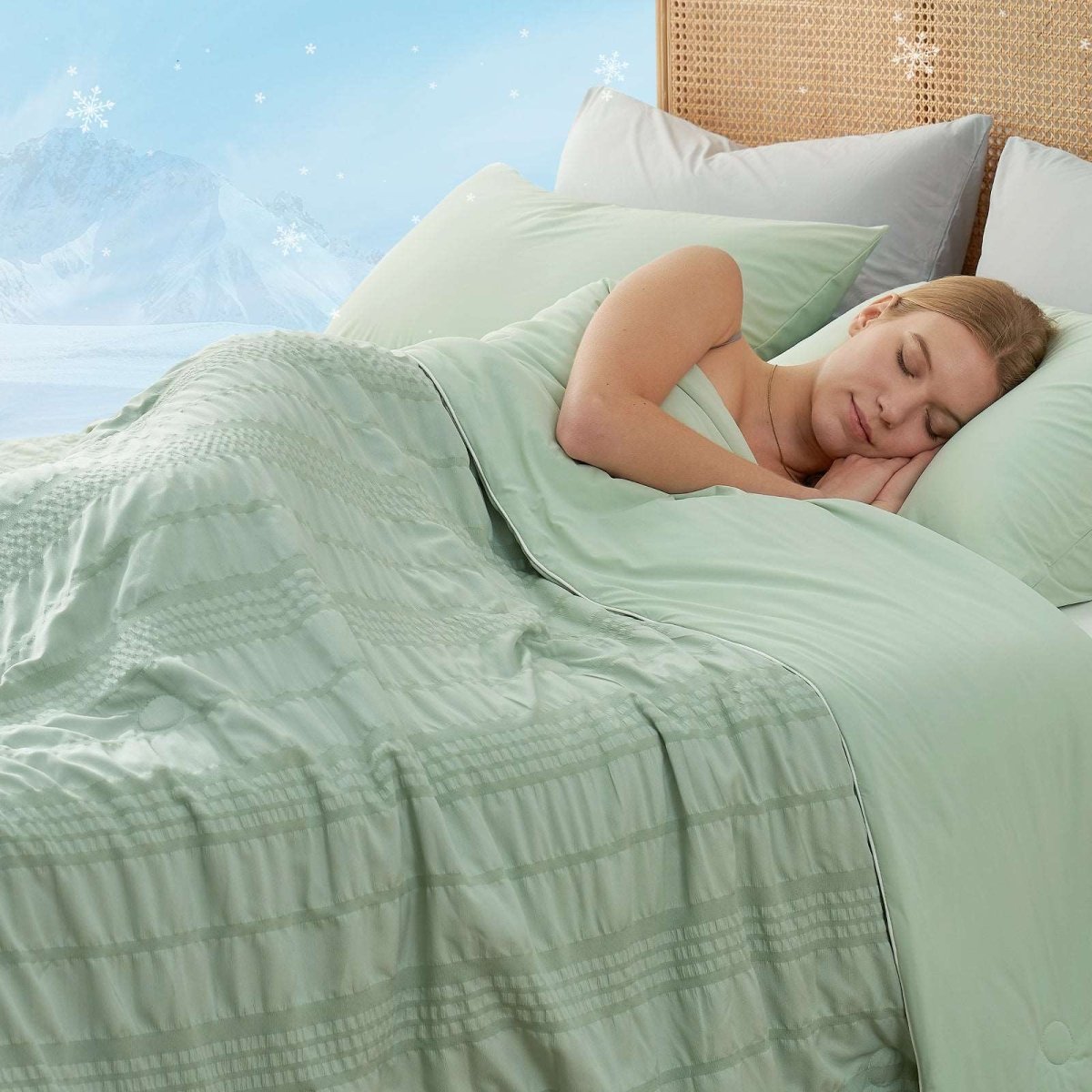 Woman sleeping under Cozy Bliss Seersucker Cooling Comforter. Green breathable blanket and pillows. #color_Sage Green