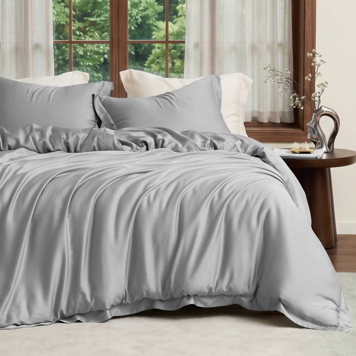 Cozy Bliss Tencel™ Eco-friendly Silky Duvet Cover Set displayed on a bed in a bedroom, showcasing the complete bedding set. #color_Grey