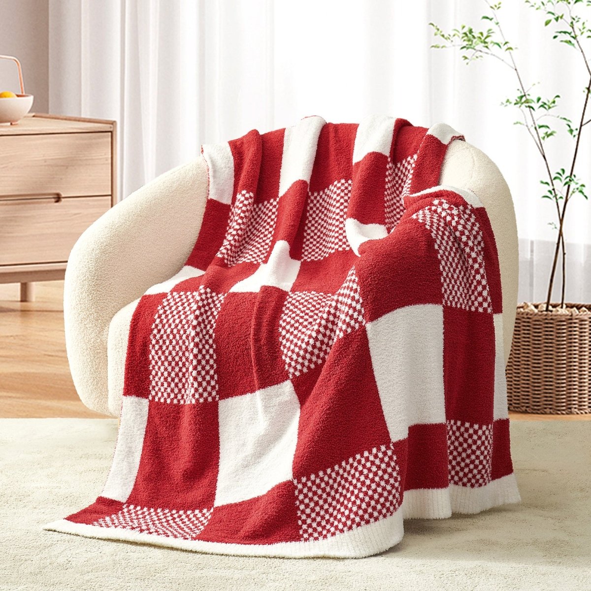 Checkered Feather Yarn Throw Blanket in Red front view draped over a chair, showcasing soft feather yarn texture and checkered pattern design. #color_Red & Cream