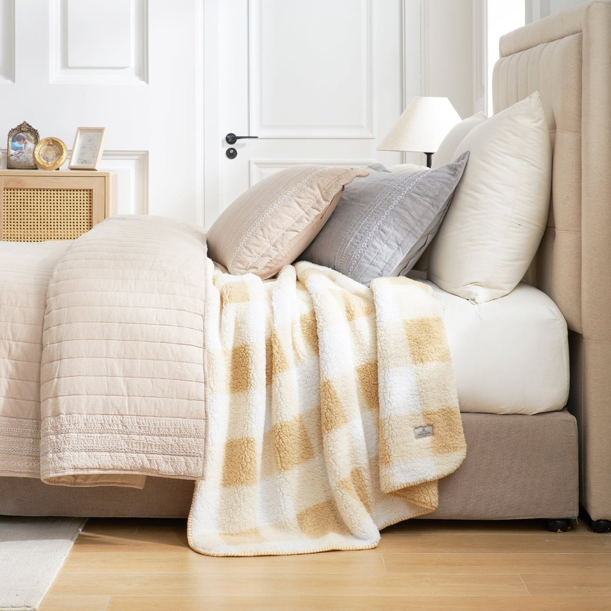 Buffalo sherpa throw blanket in Buffalo Plaid-beige draped over bed, creating a warm and cozy bedroom look #color_Buffalo Plaid-beige