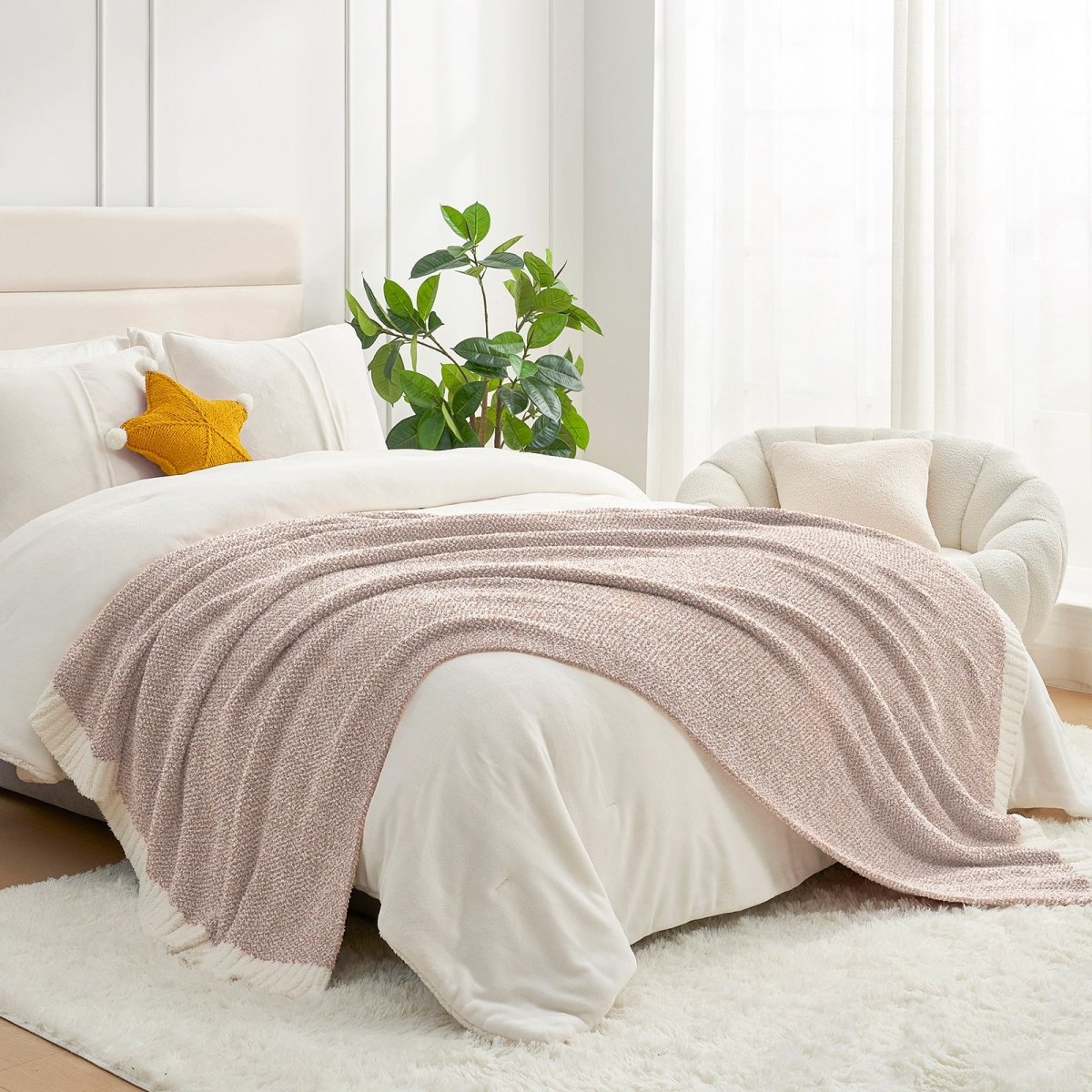 Heather Feather Yarn Throw Blanket in brown styled on a bed, enhancing bedroom decor with a soft, elegant and cozy layered look.  #Color_Light Brown