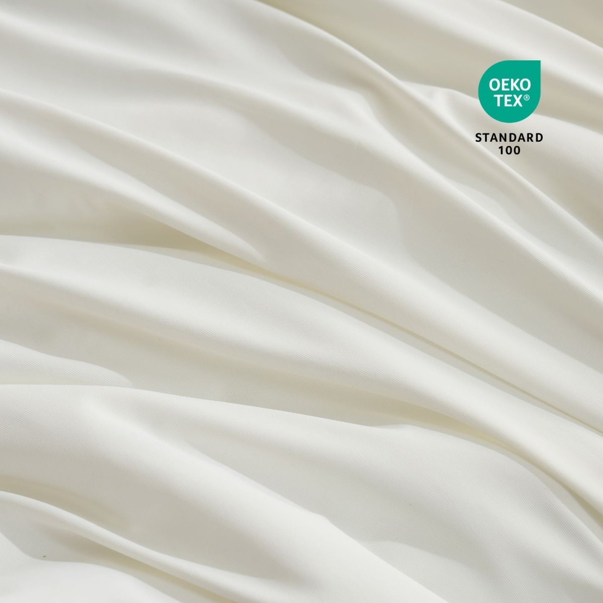 Close-up of Cozy Bliss cooling pillowcases fabric with Oeko-Tex Standard 100 certification.#color_Off White