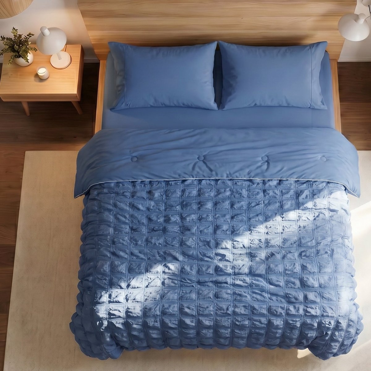 Cozy Bliss white seersucker plaid cooling comforter neatly laid out on a bed, highlighting the textured fabric design for summer.#color_ Dark Blue