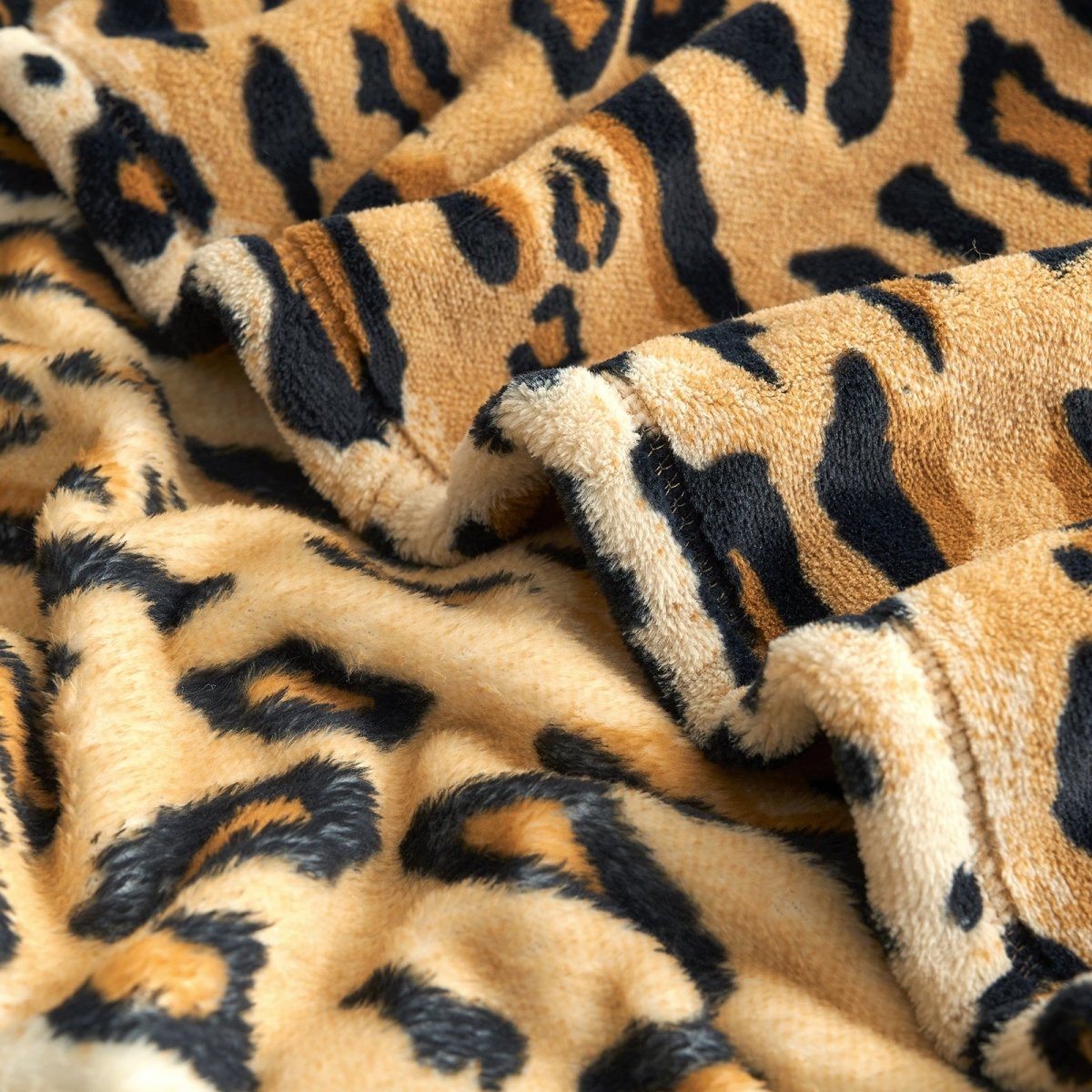 Close up of leopard print milkyplush throw blanket in Brown Leopard, showcasing plush texture and softness #color_Brown Leopard