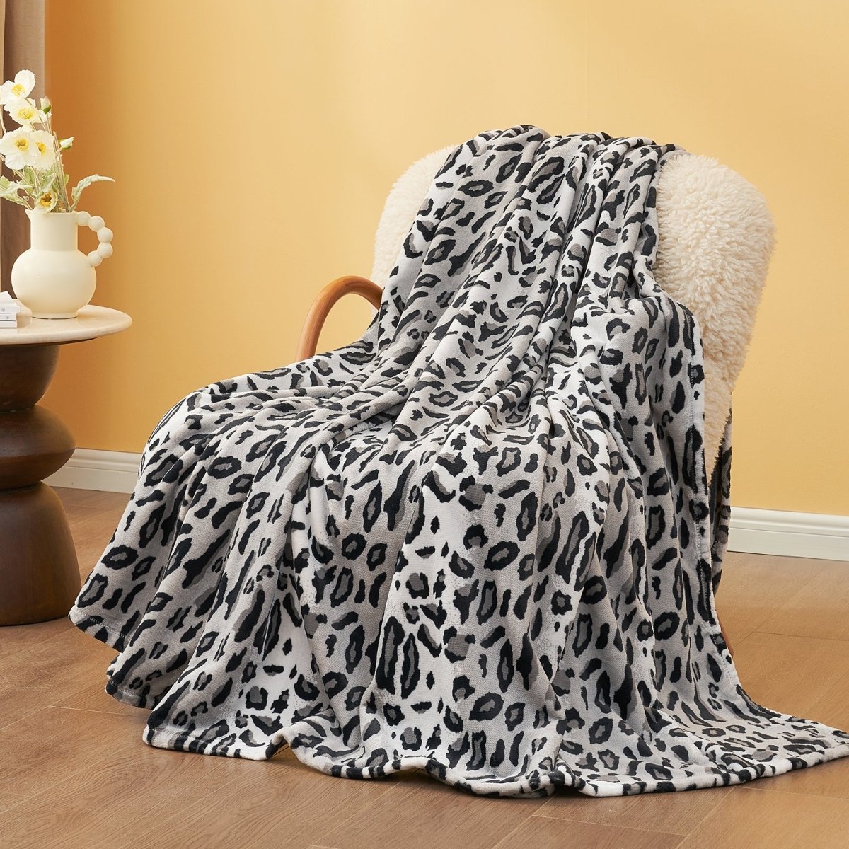 Leopard print throw blanket on a chair, featuring soft, cozy blanket #color_Snow Leopard