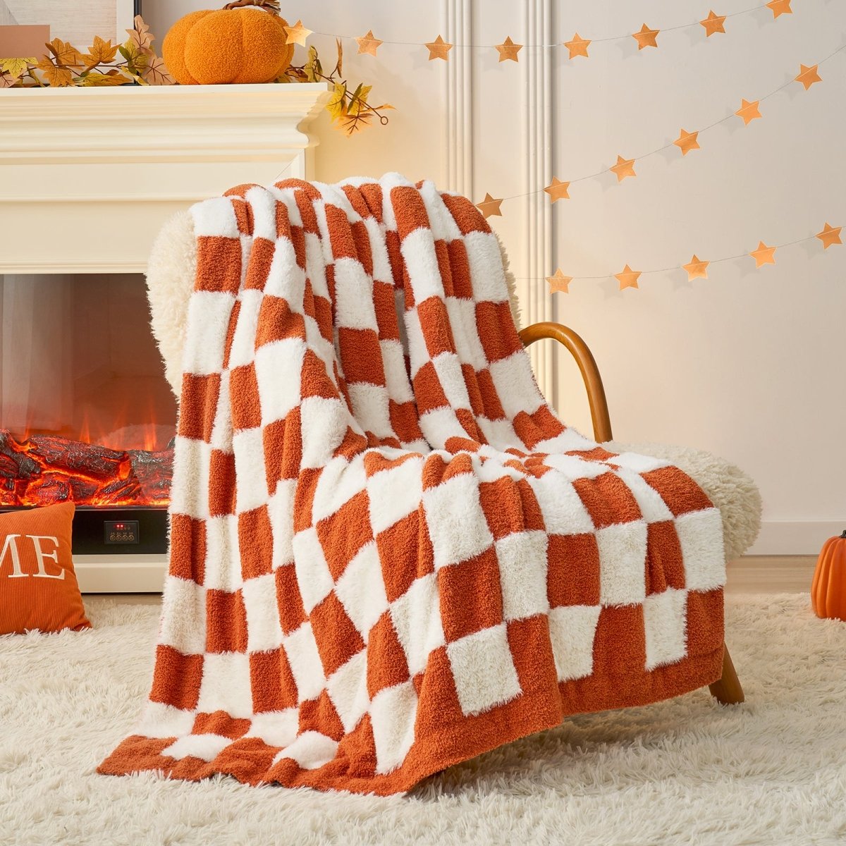 Checkered Faux Fur Feather Yarn Throw Blanket in Orange draped over an armchair, adding warmth and vibrancy. #color_Orange