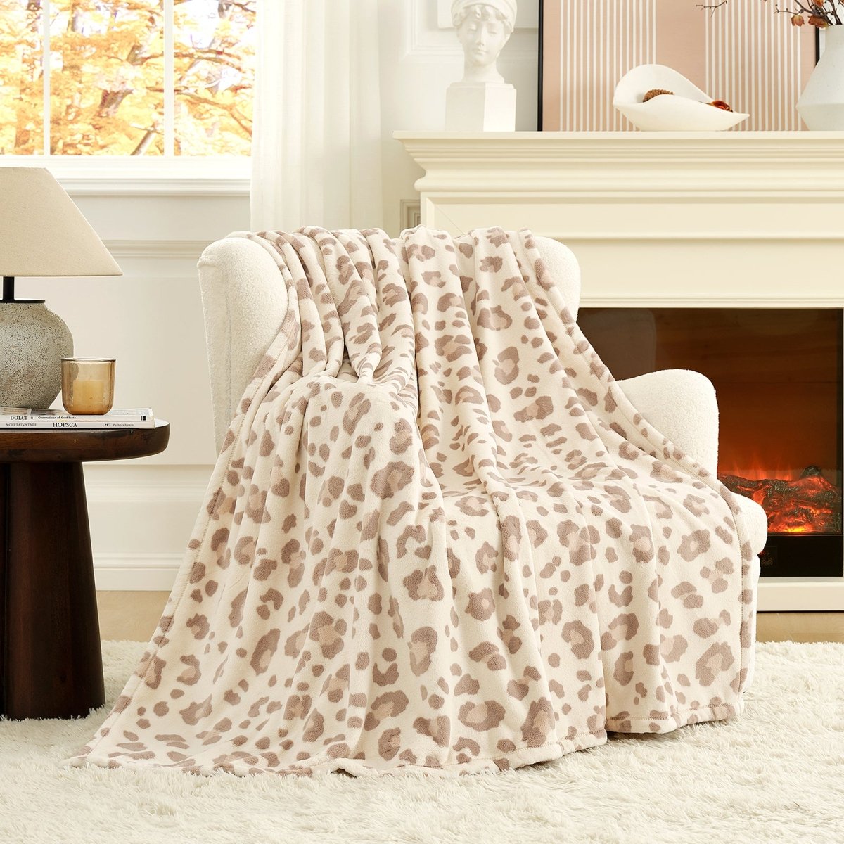 Leopard print milkyplush throw blanket in Khaki Leopard layered on a sofa, creating a cozy and warm environment #color_Khaki Leopard