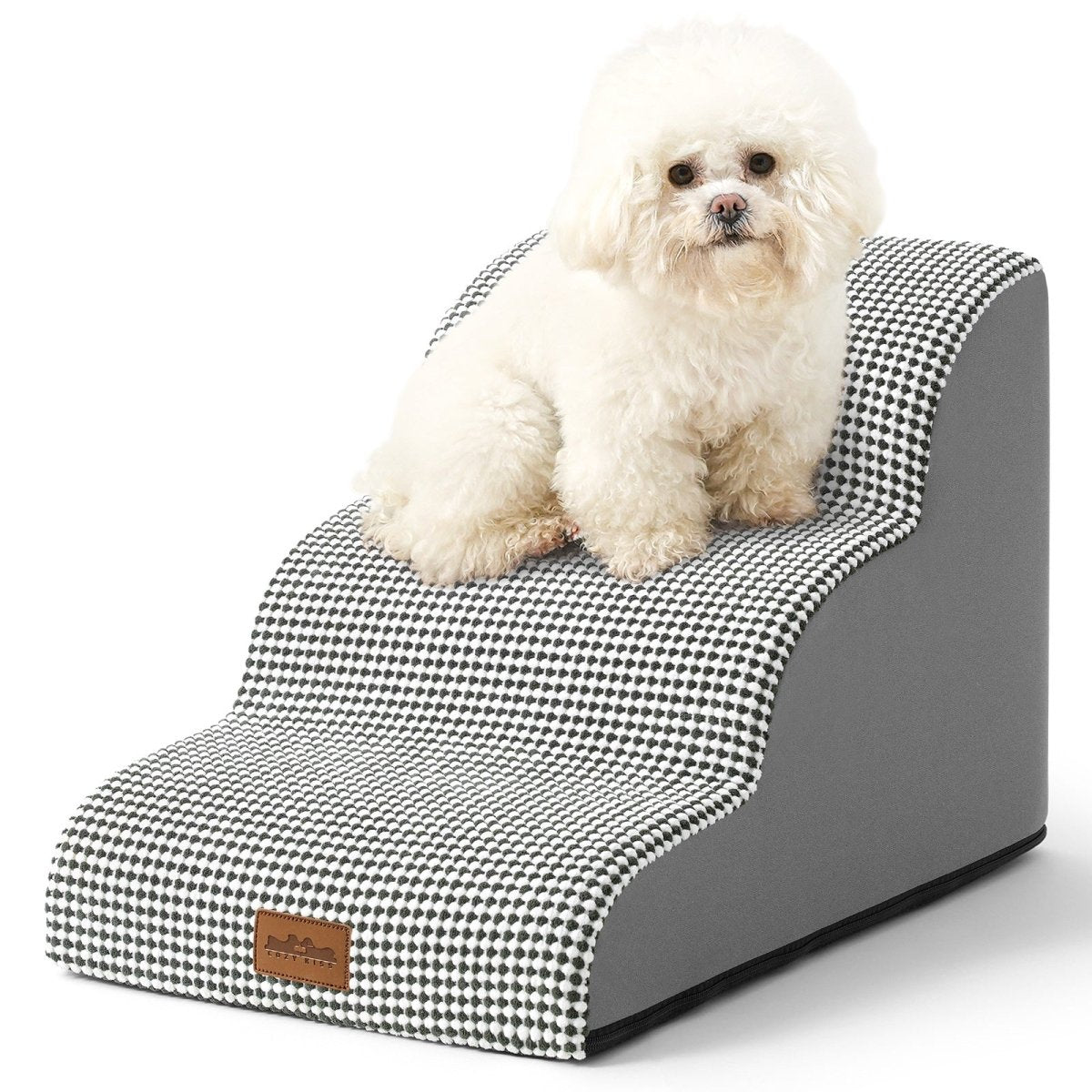 Small white dog sitting on a black and white checkered pet ramp with gray base.#color_Black White