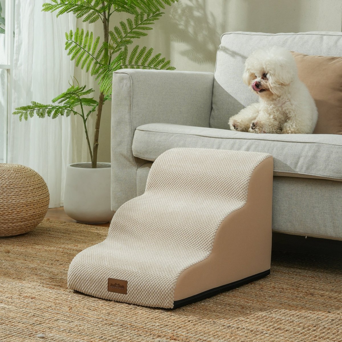 Beige pet step leading to a white couch with a small dog sitting on it, in a living room setting.#Color_Beige