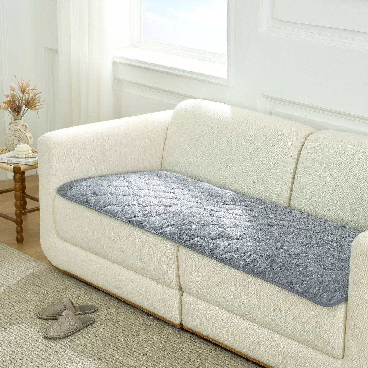Gray couch cover on a white sofa in a living room setting.#color_Dark Grey