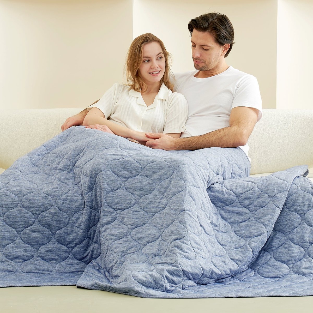 Couple relaxing under Cozy Bliss cooling blanket in blue cloud pattern, for cozy sleep #color_Dark Blue