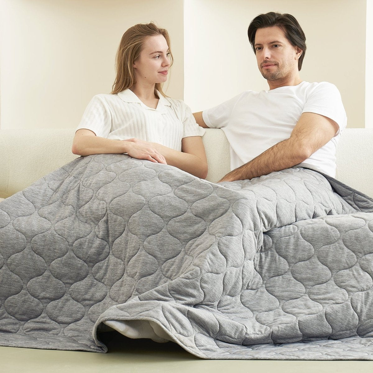 Couple relaxing under a cozy blanket #color_Light Grey