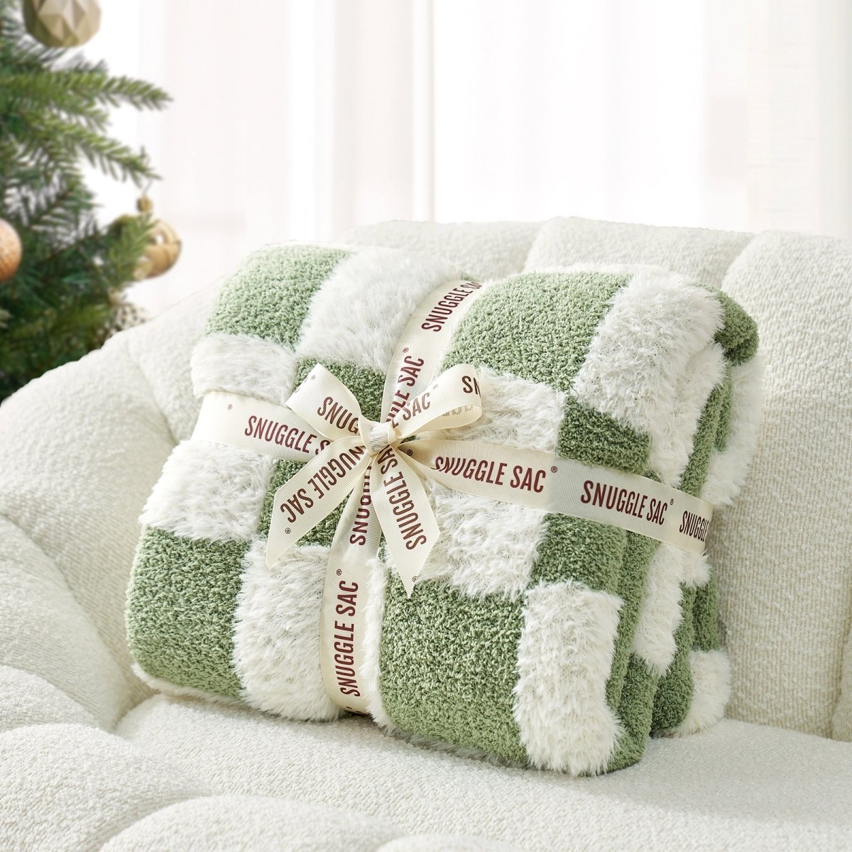 Checkered Faux Fur Feather Yarn Throw Blanket in Sage Green & White neatly folded with ribbon, ideal for gifting. #color_Sage Green & White