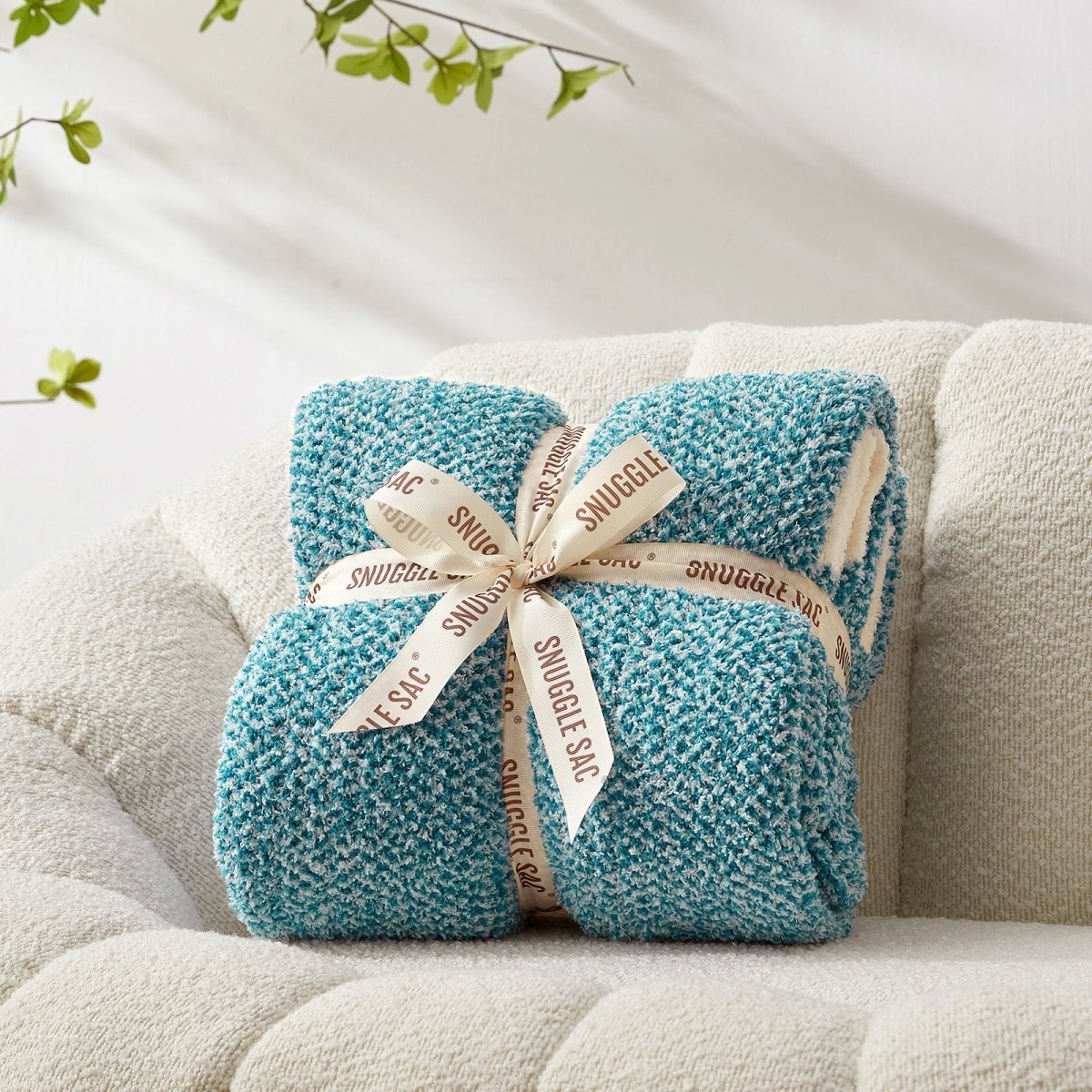 Heather Feather Yarn Throw Blanket in heather teal neatly folded with ribbon, a perfect gift idea for holidays, housewarming or special occasions. #Color_Heather Teal