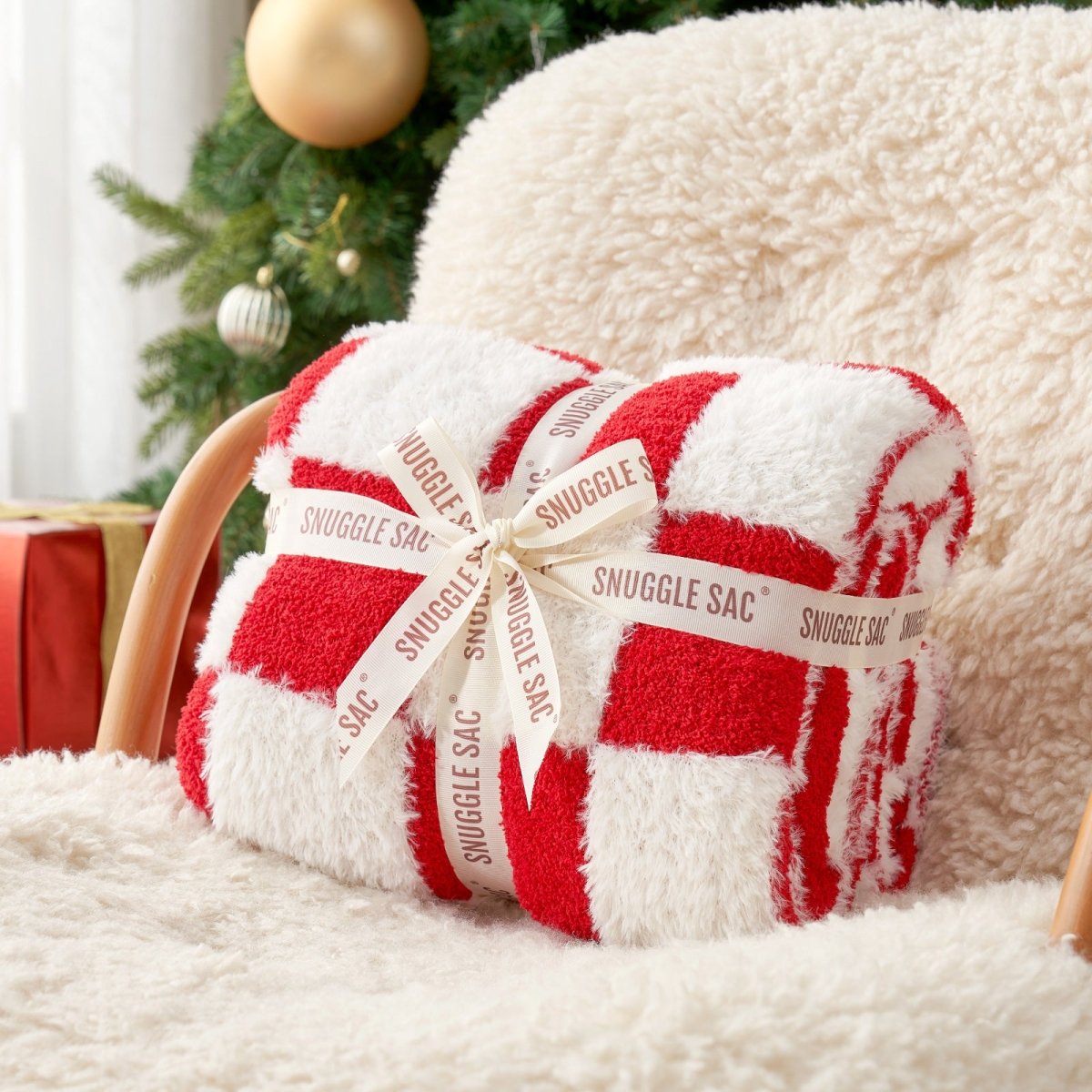 Checkered Faux Fur Feather Yarn Throw Blanket in Red & Cream neatly folded with ribbon, ideal for gifting. #color_Red & Cream