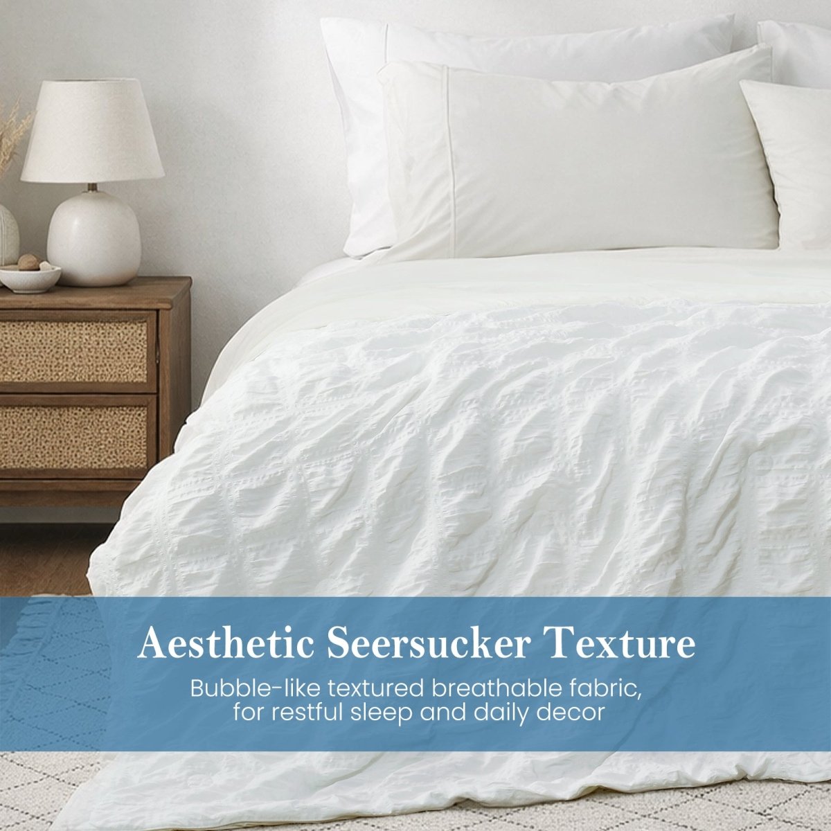 Close-up of white seersucker comforter, textured breathable fabric with soft cooling touch.#Color_Off White