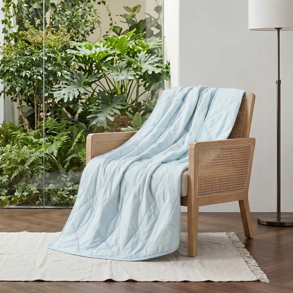 Cozy Bliss Cool blue Chill Weave cooling blanket on a couch #Color_Cool Blue