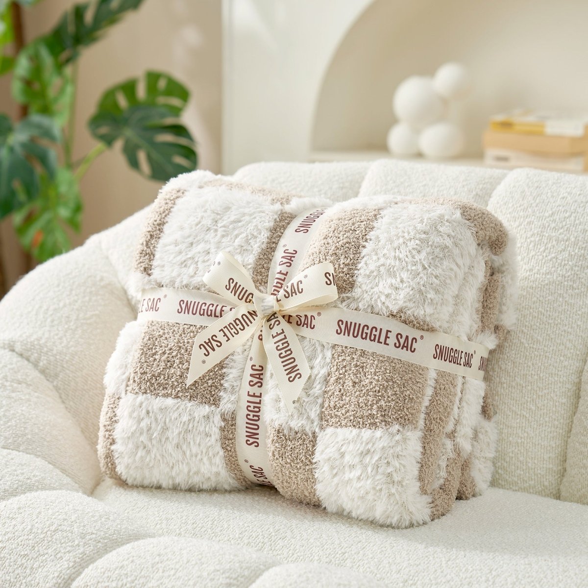 Checkered Faux Fur Feather Yarn Throw Blanket in Beige & White neatly folded with ribbon, perfect as a cozy gift option. #color_Beige & White