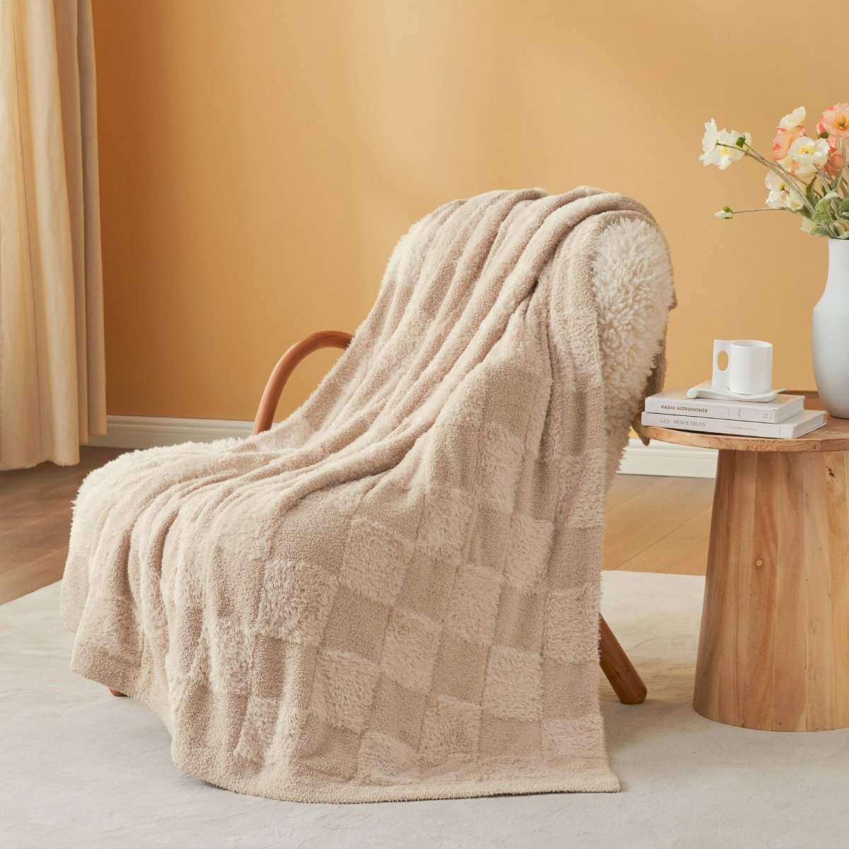 Checkered Faux Fur Feather Yarn Throw Blanket in Beige draped over an armchair, adding warmth and elegance. #color_Beige