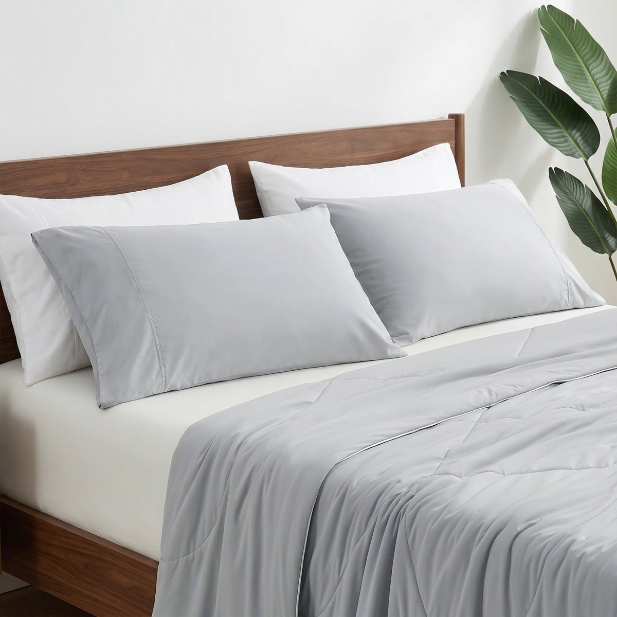 Cozy Bliss cooling pillowcases on bed in side view, ideal for cool and comfortable sleep. #color_Light Grey