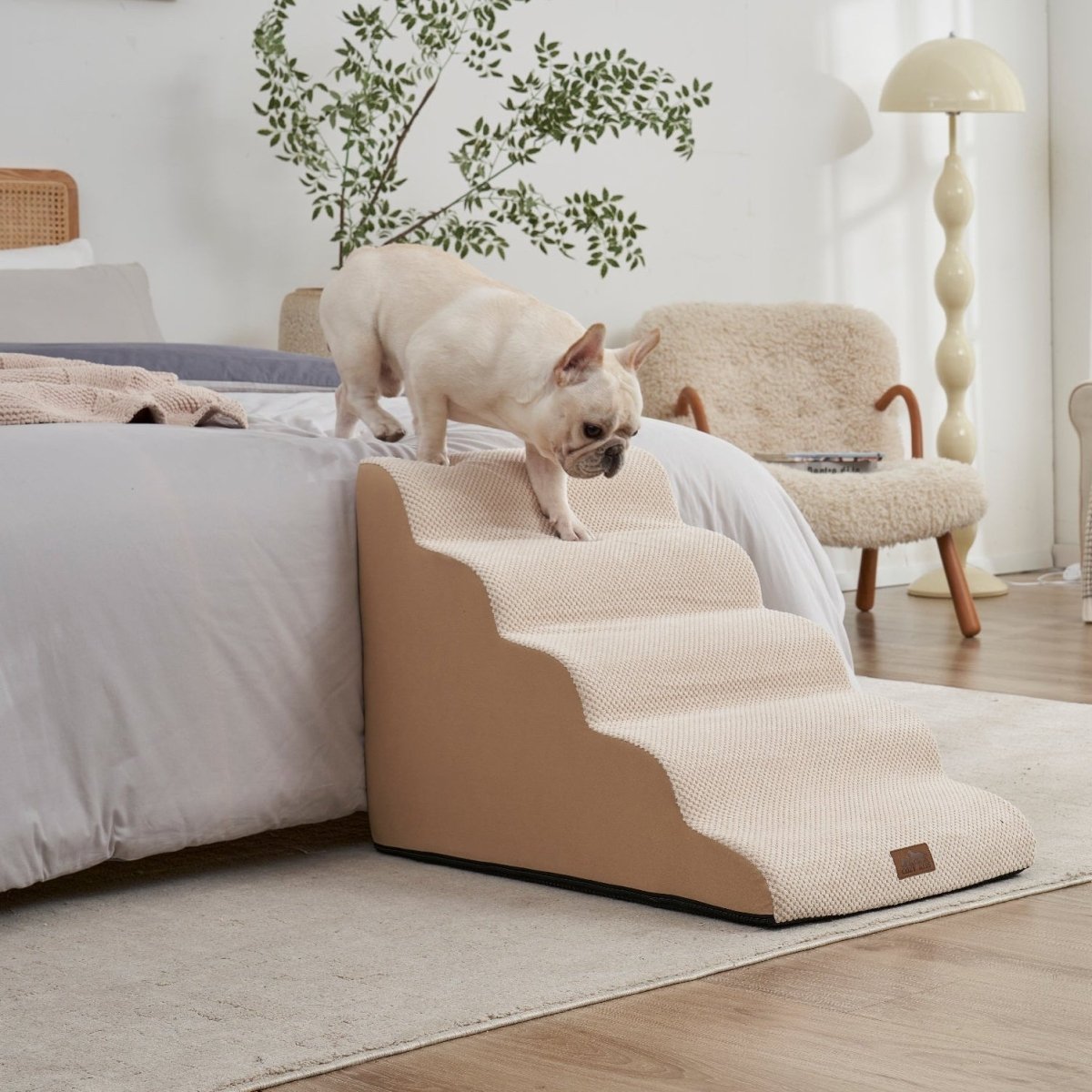 Dog using a beige pet ramp in a living room setting#color_Beige